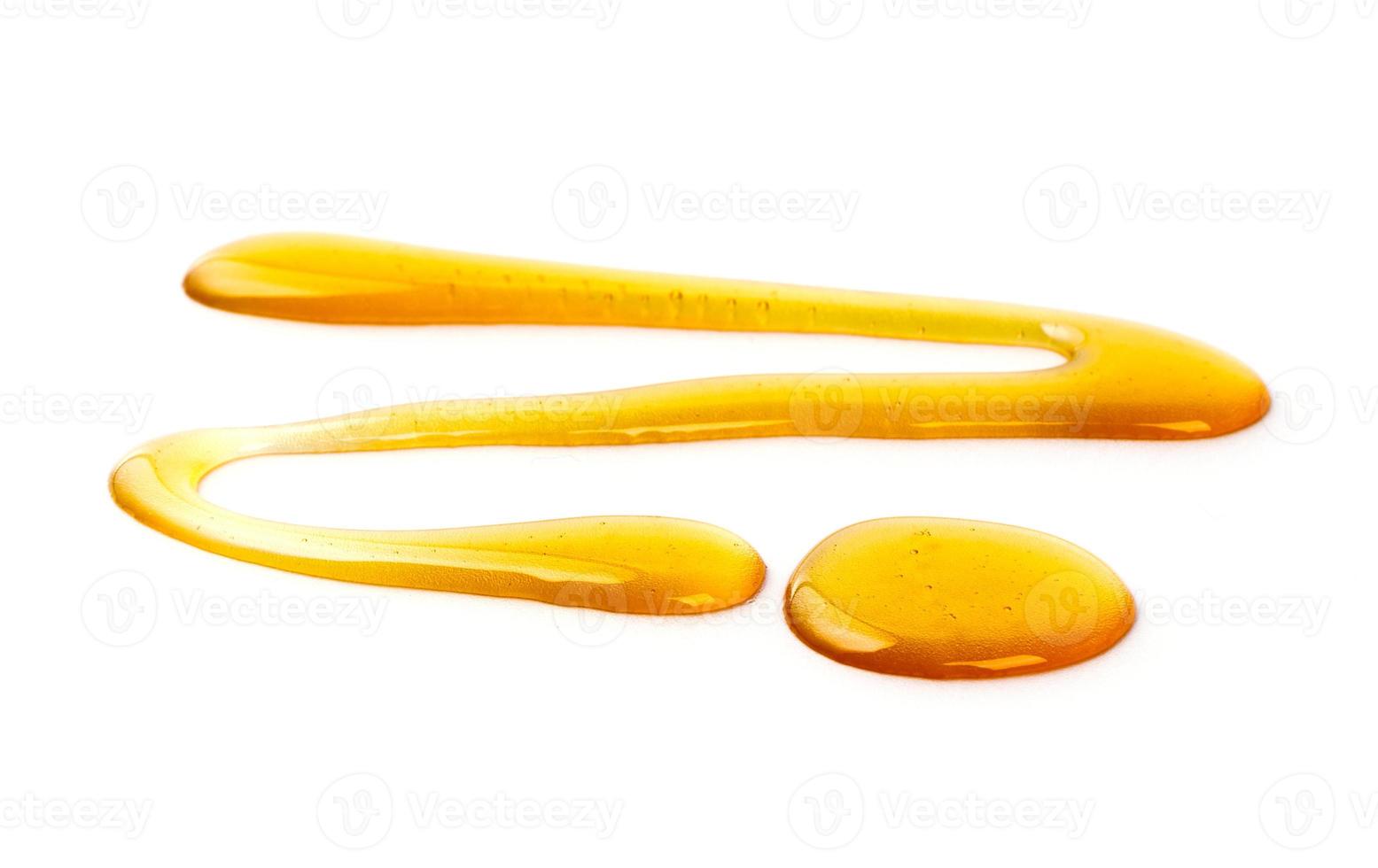 Honey drop isolated on white background, selective focus, isolated on white background photo