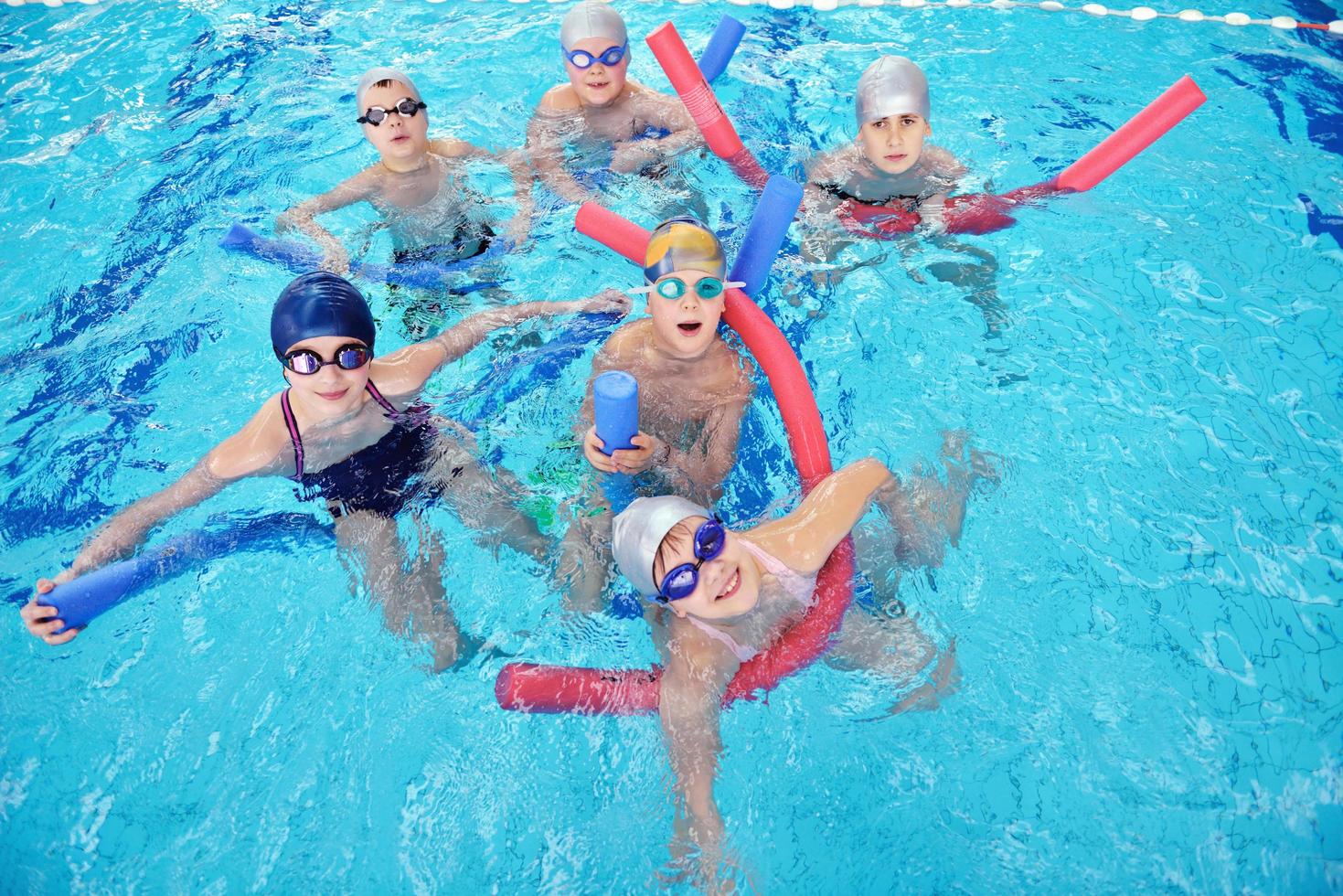 happy children group  at swimming pool photo