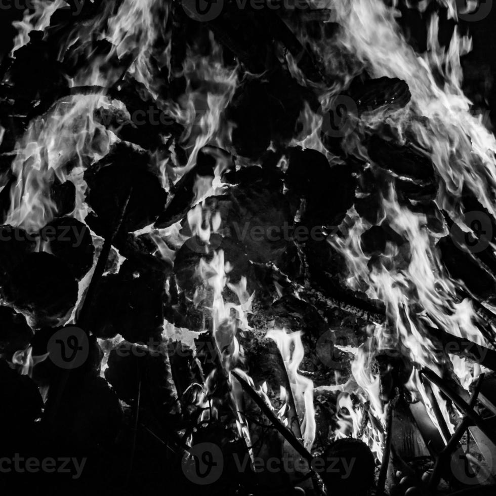 Fire flames on black background, Blaze fire flame texture background, Beautifully, the fire is burning, Fire flames with wood and cow dung bonfire Black and White photo