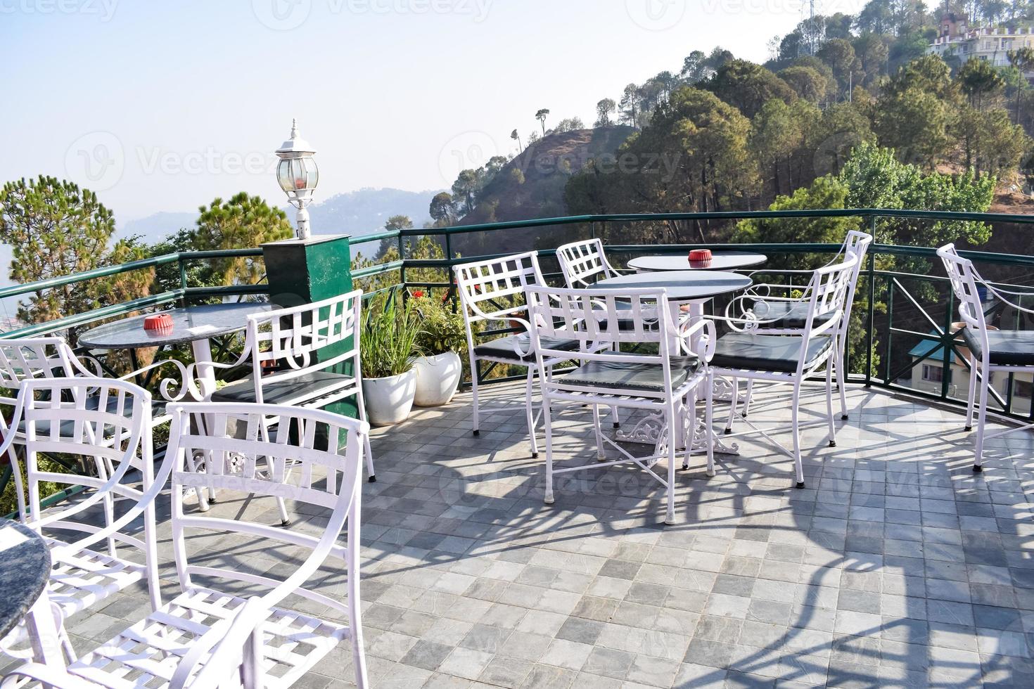 Early morning view of Modern rooftop restaurant at Kasauli, Himachal Pradesh in India, View of mountain hills from open air restaurant in Kasauli, Kasauli Rooftop restaurant photo