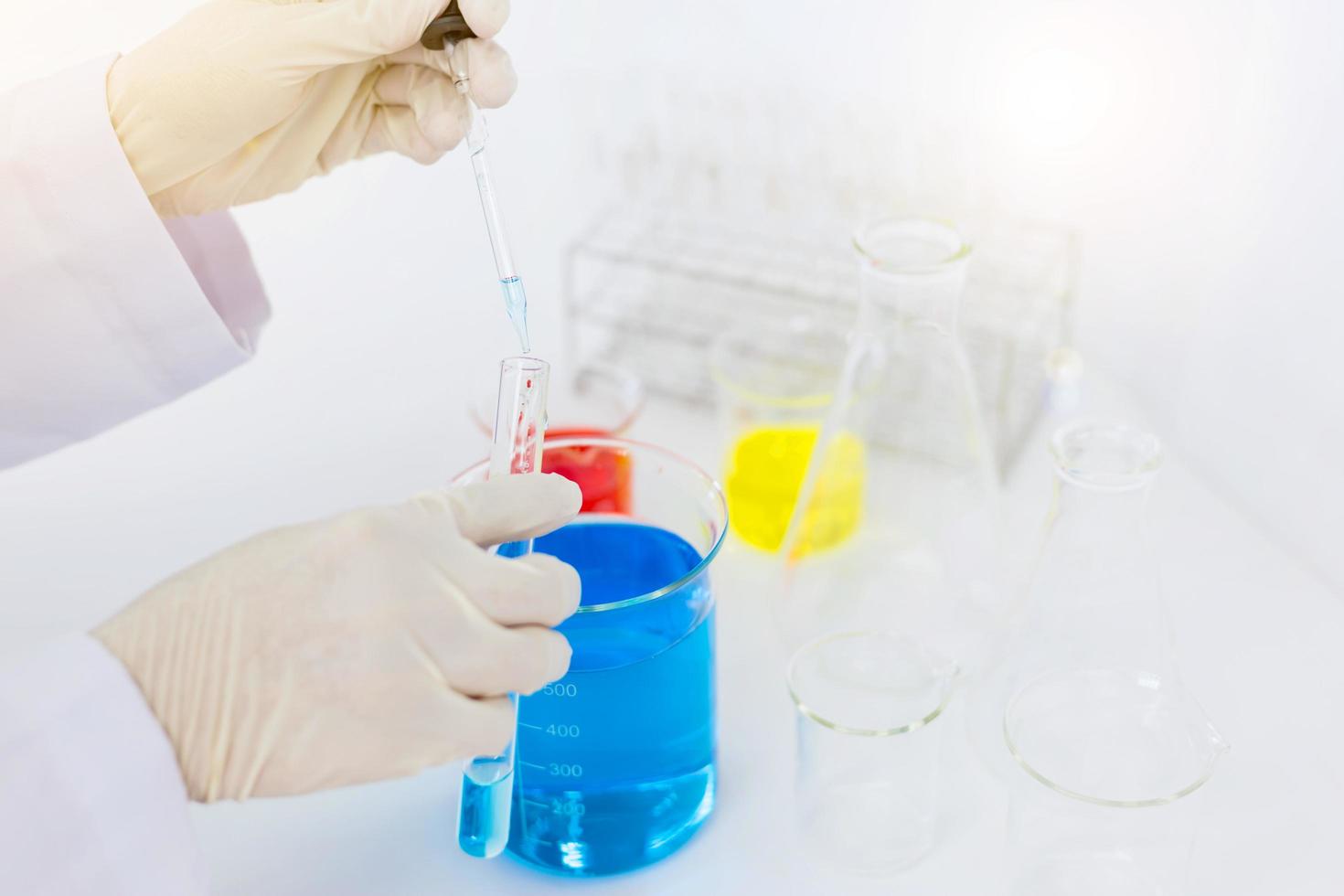 scientist hand holding laboratory test tube, science laboratory research and development concept photo