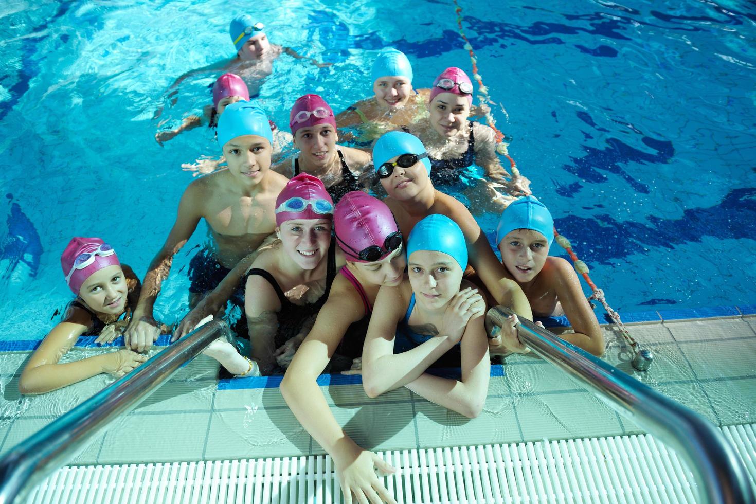 happy childrens at swimming pool photo