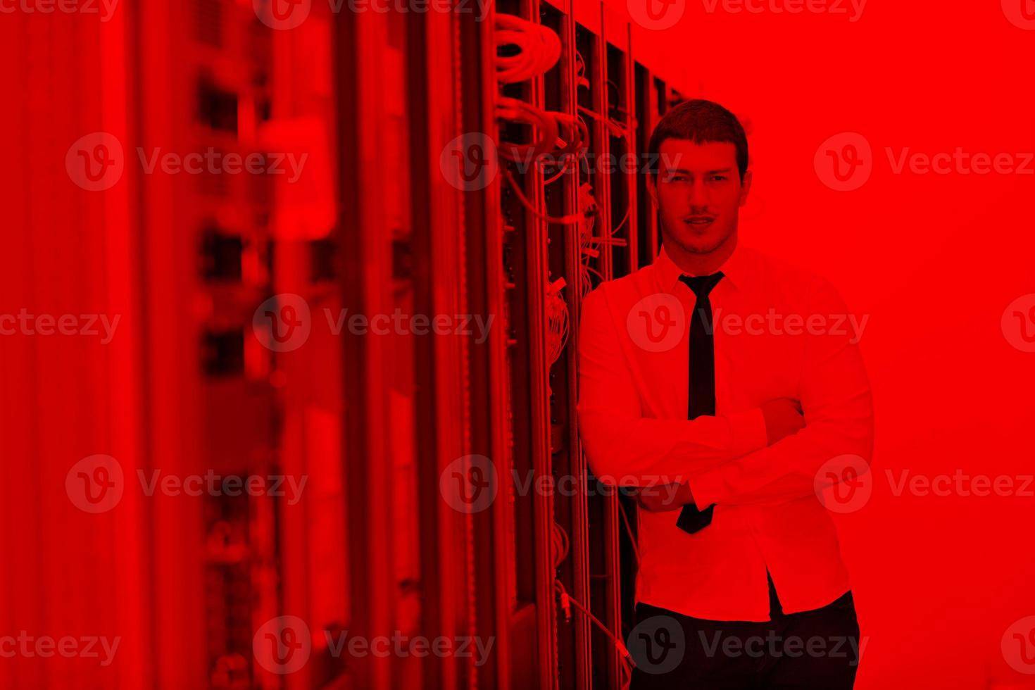 young it engeneer in datacenter server room photo