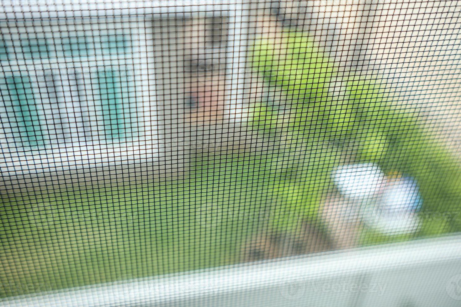 mosquito net wire screen on house window protection against insect photo