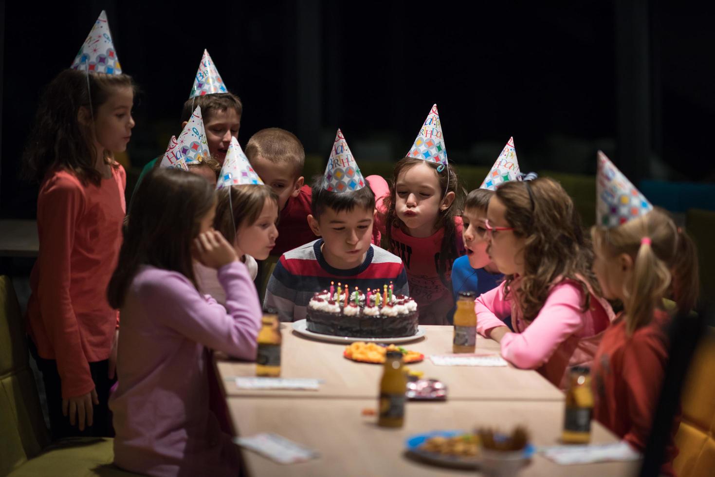 The young boy joyfully celebrating his birthday photo