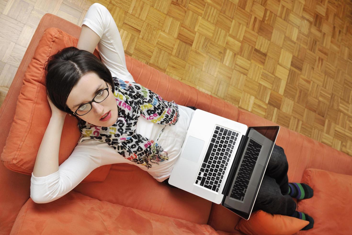 woman using a laptop computer at home photo