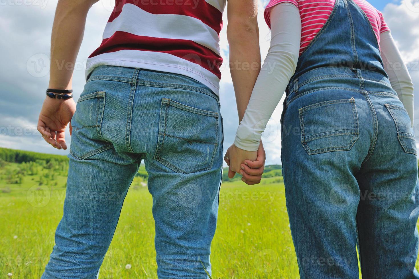 Portrait of romantic young couple smiling together outdoor photo