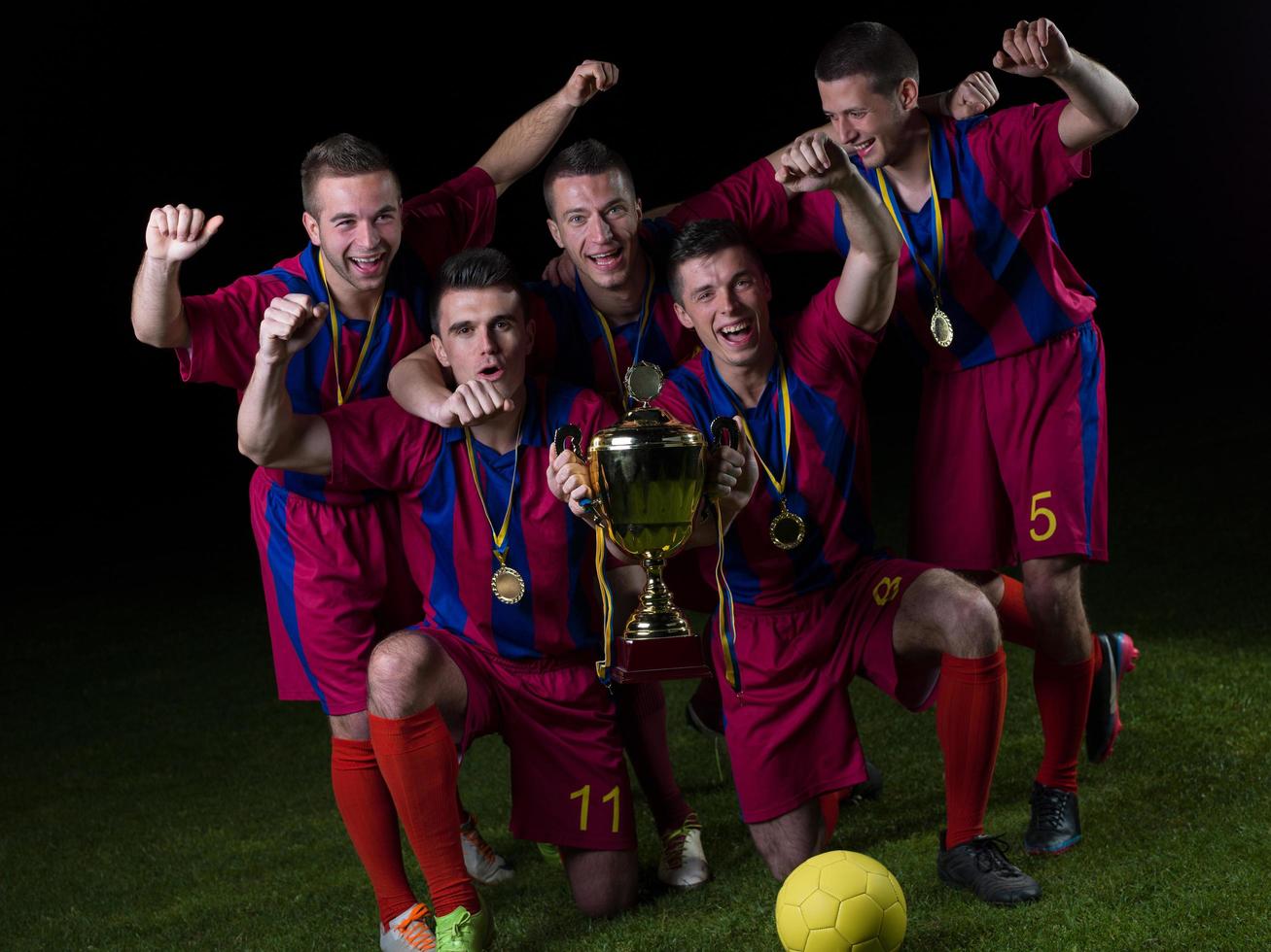 soccer players celebrating victory photo