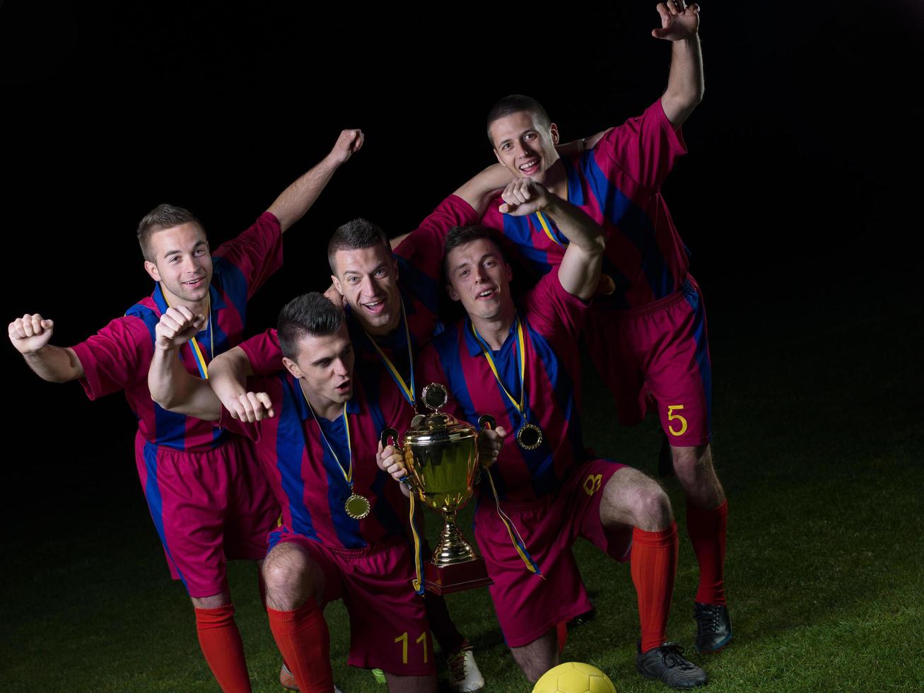 soccer players celebrating victory photo