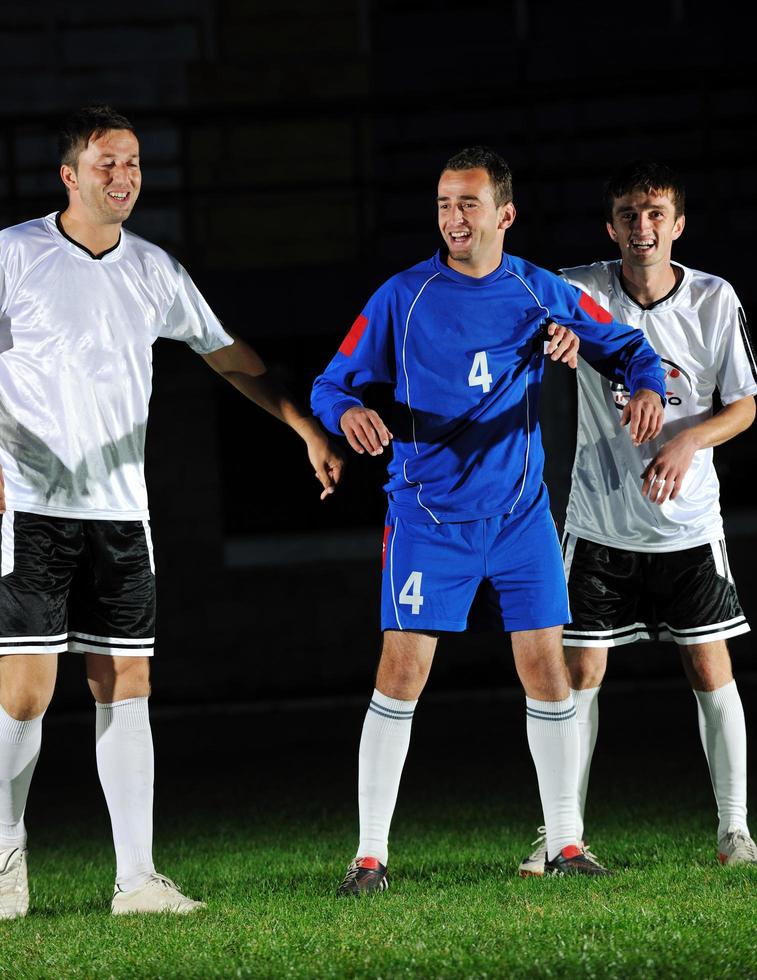 football players in action for the ball photo