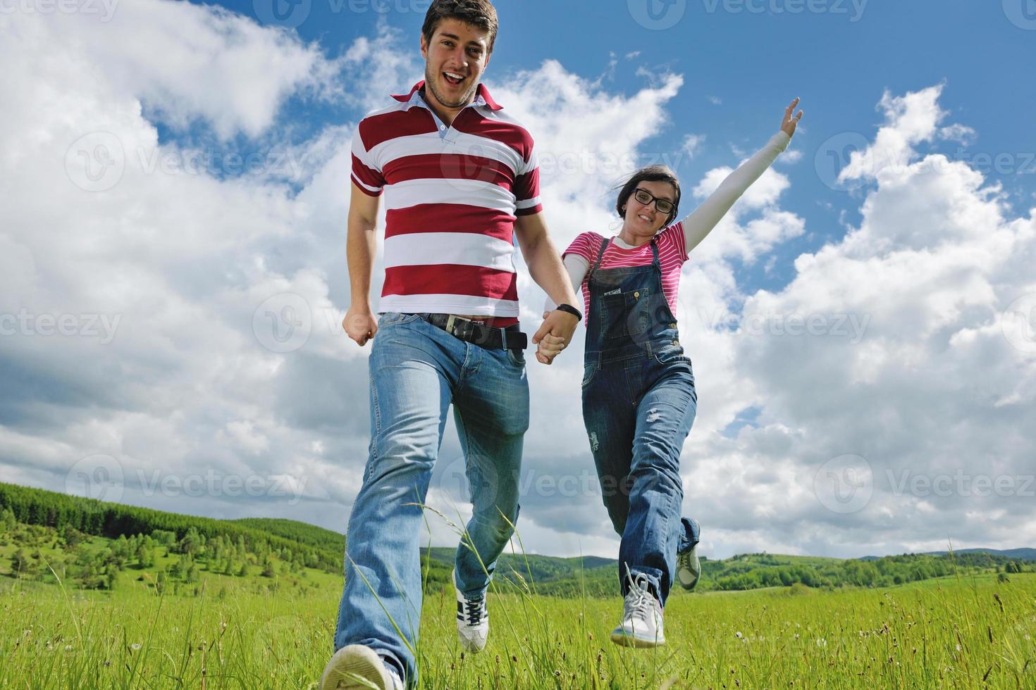 Portrait of romantic young couple smiling together outdoor photo