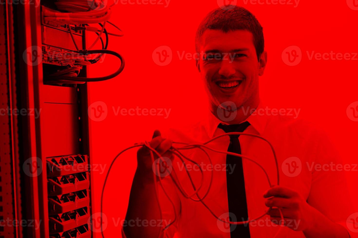 young it engeneer in datacenter server room photo