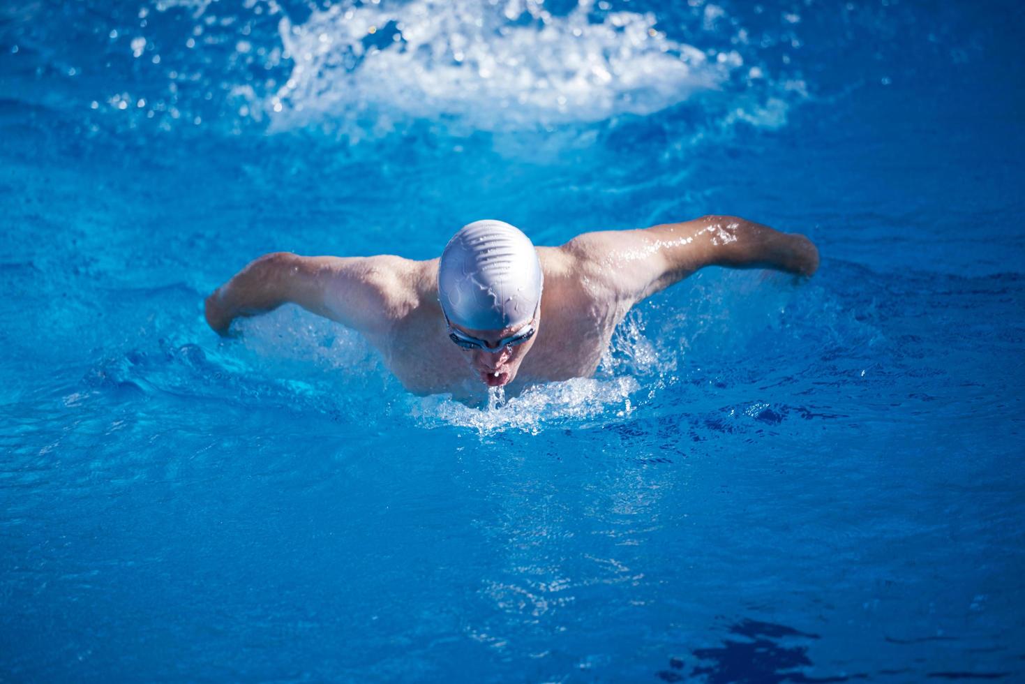 swimmer excercise on indoor swimming poo photo