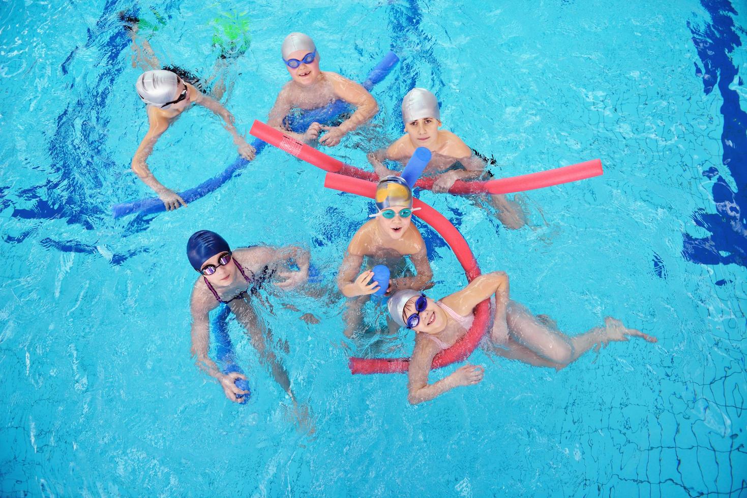 happy children group  at swimming pool photo