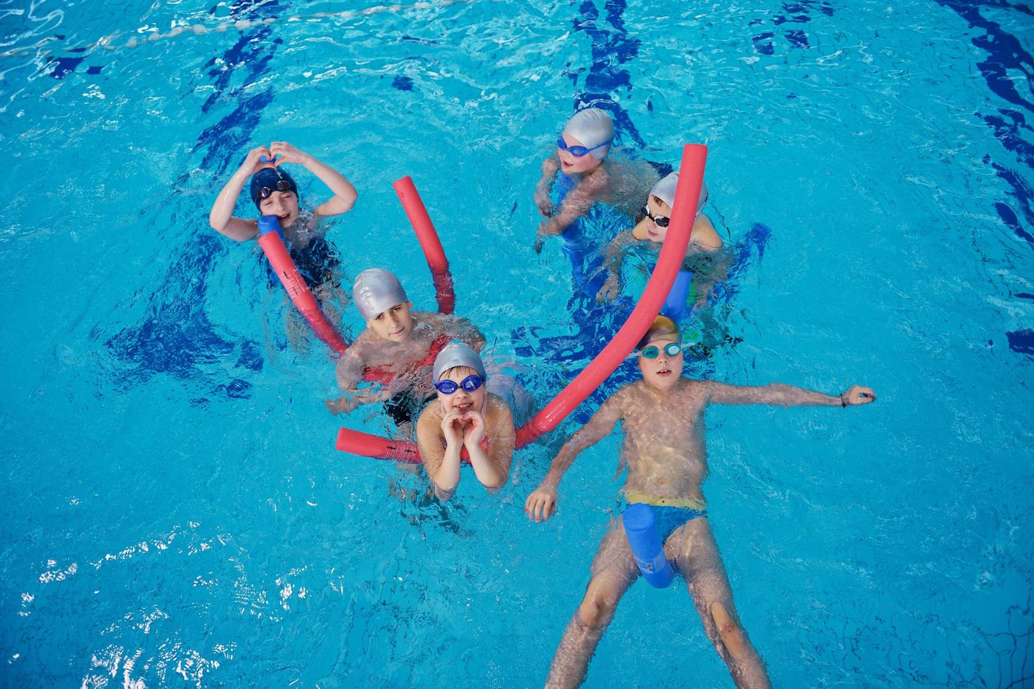 happy children group  at swimming pool photo