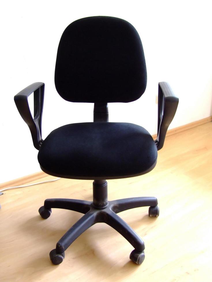 black office chair on parquet photo