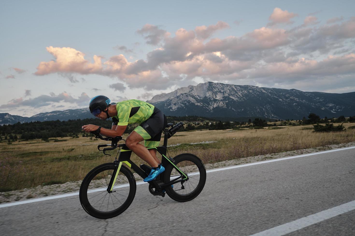 triathlon athlete riding bike photo