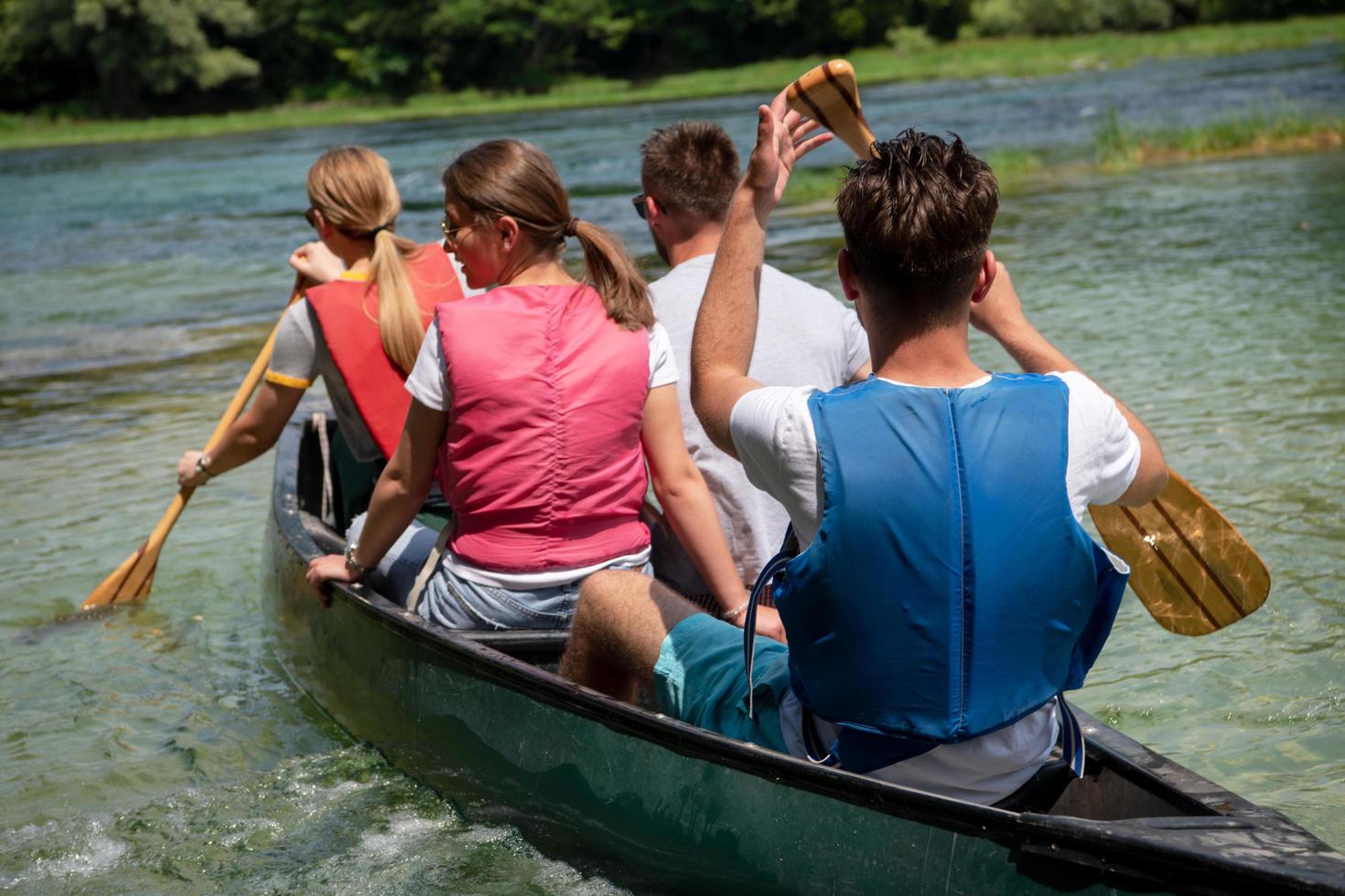 Friends canoeing outside photo