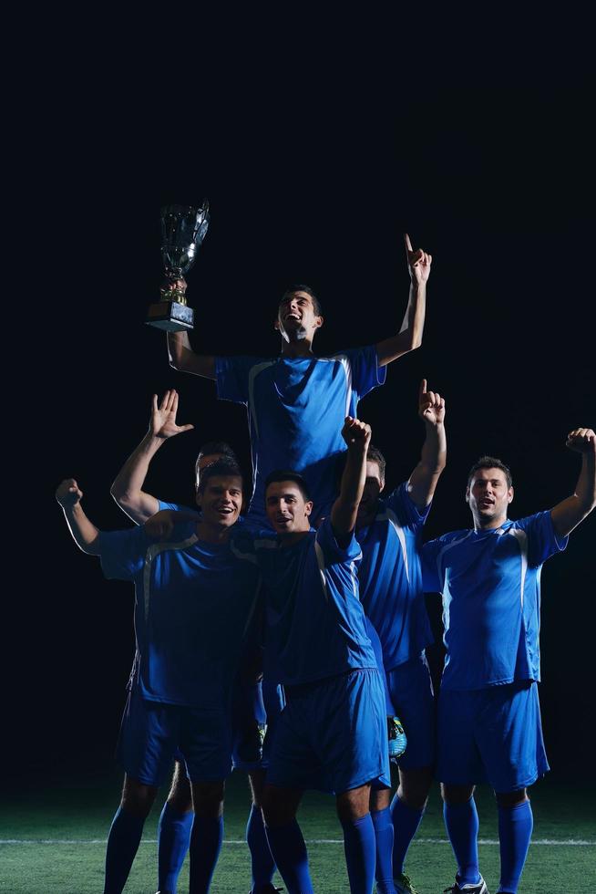 soccer players celebrating victory photo