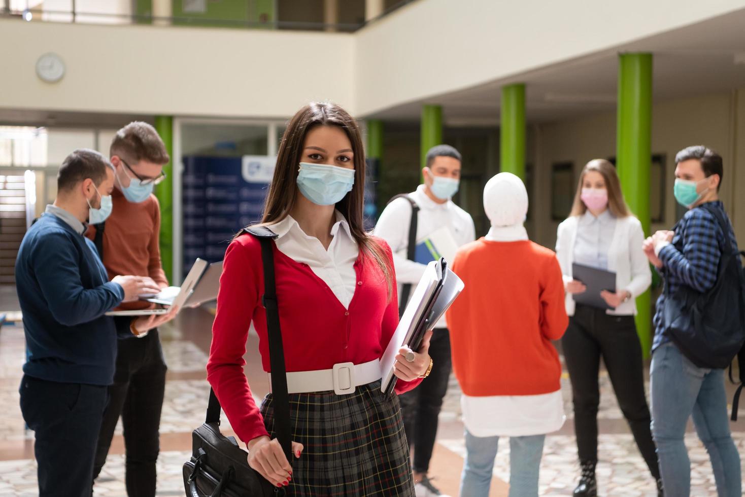 Portrait of multiethnic students group at university wearing protective face mask photo