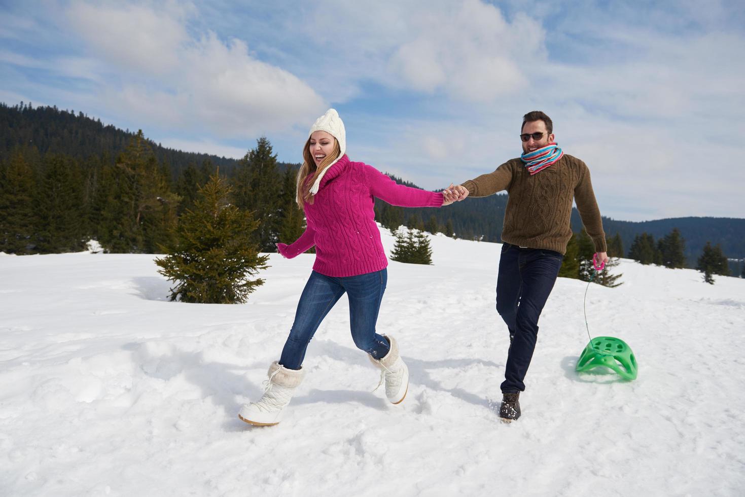 happy young couple having fun on fresh show on winter vacation photo