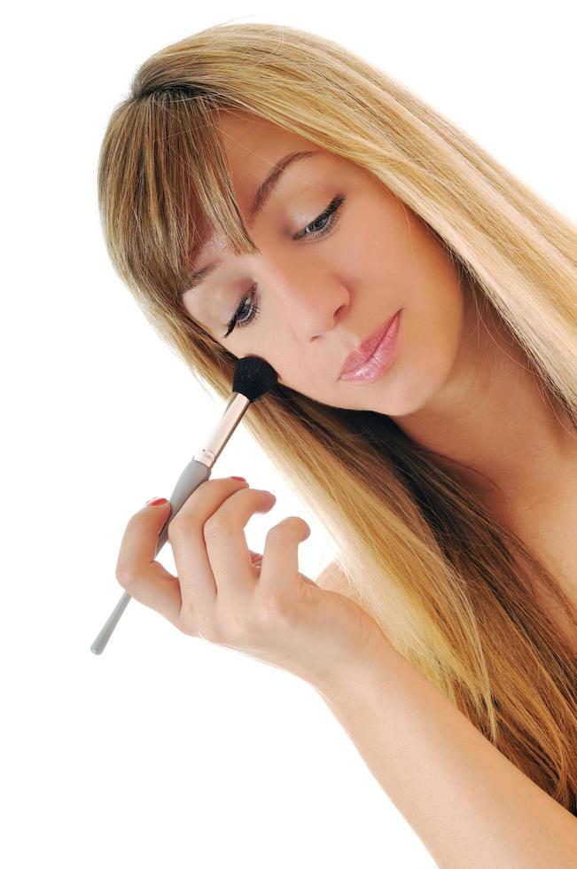 Woman applying makeup photo