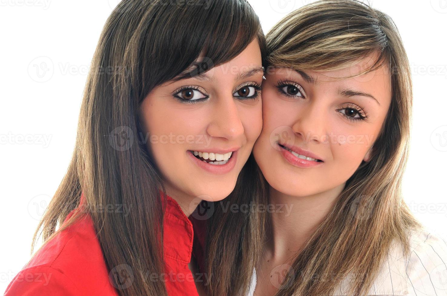 dos niñas aisladas en blanco foto