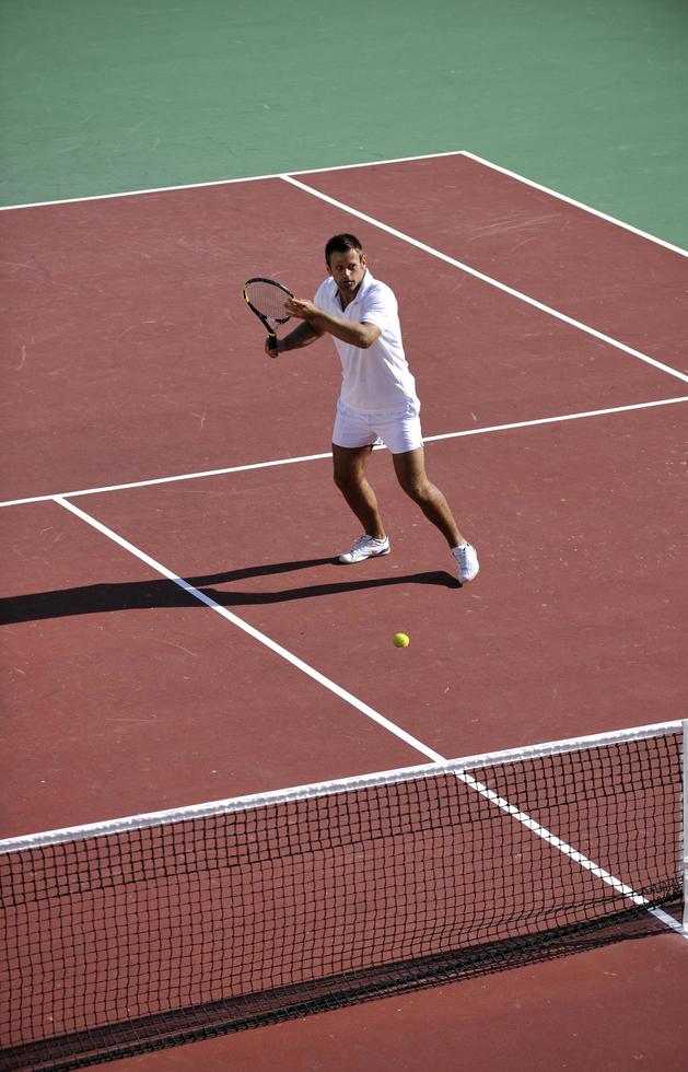 young woman play tennis outdoor photo