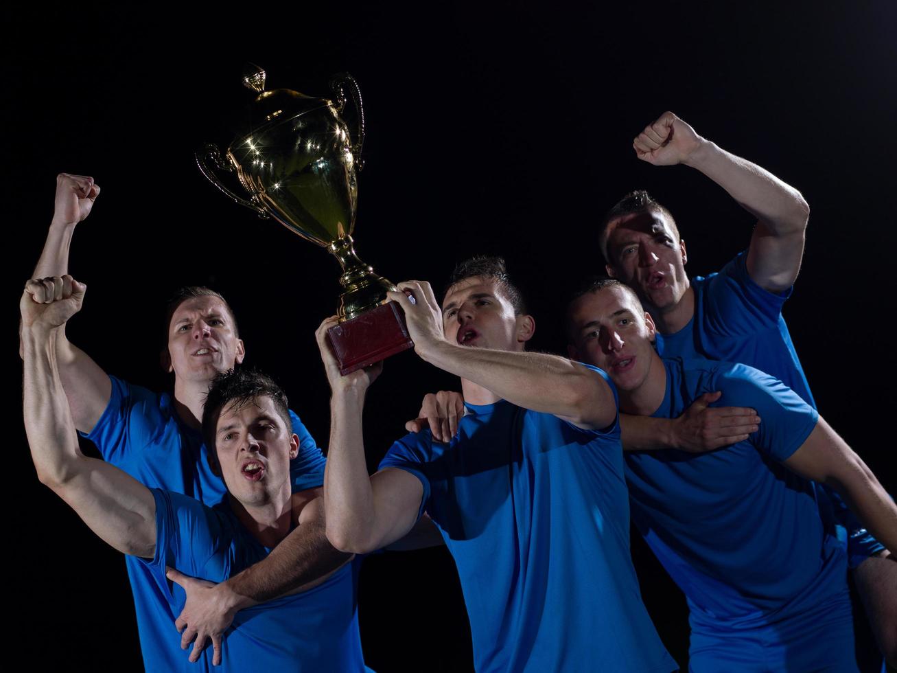 soccer players celebrating victory photo