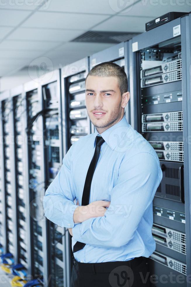 young it engeneer in datacenter server room photo