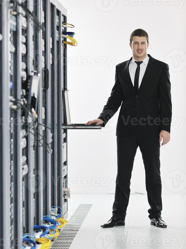 young it engeneer in datacenter server room photo