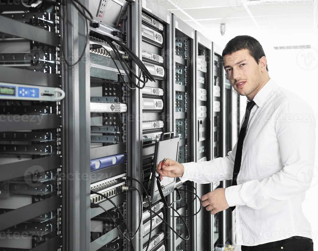 young it engeneer in datacenter server room photo