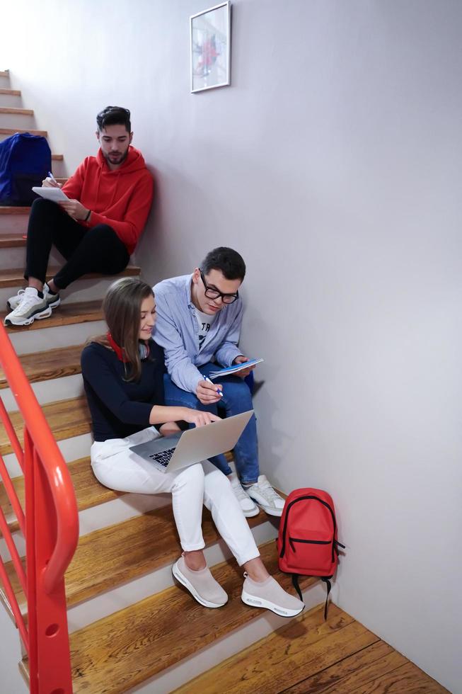 students use modern technology in school to create projects photo