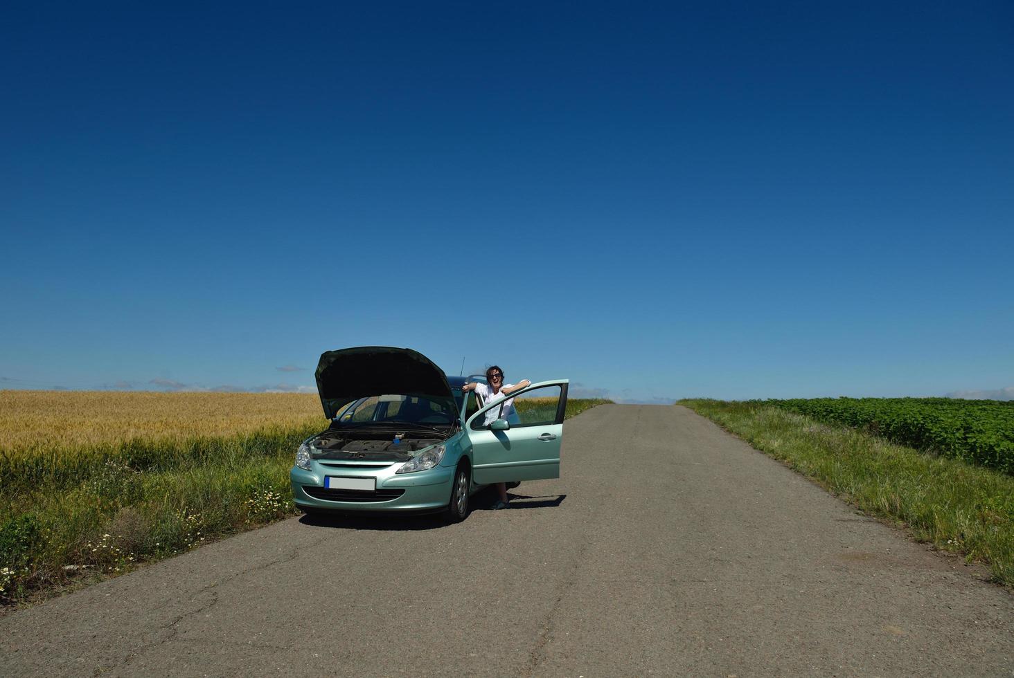 woman with broken car photo