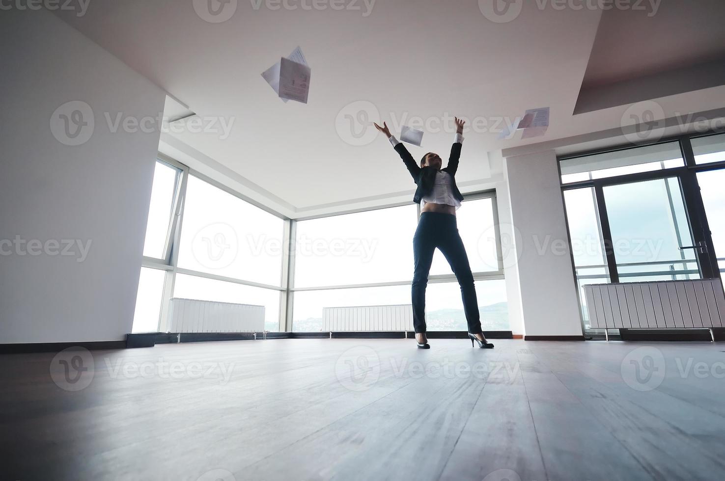 young business woman throw papers in air photo