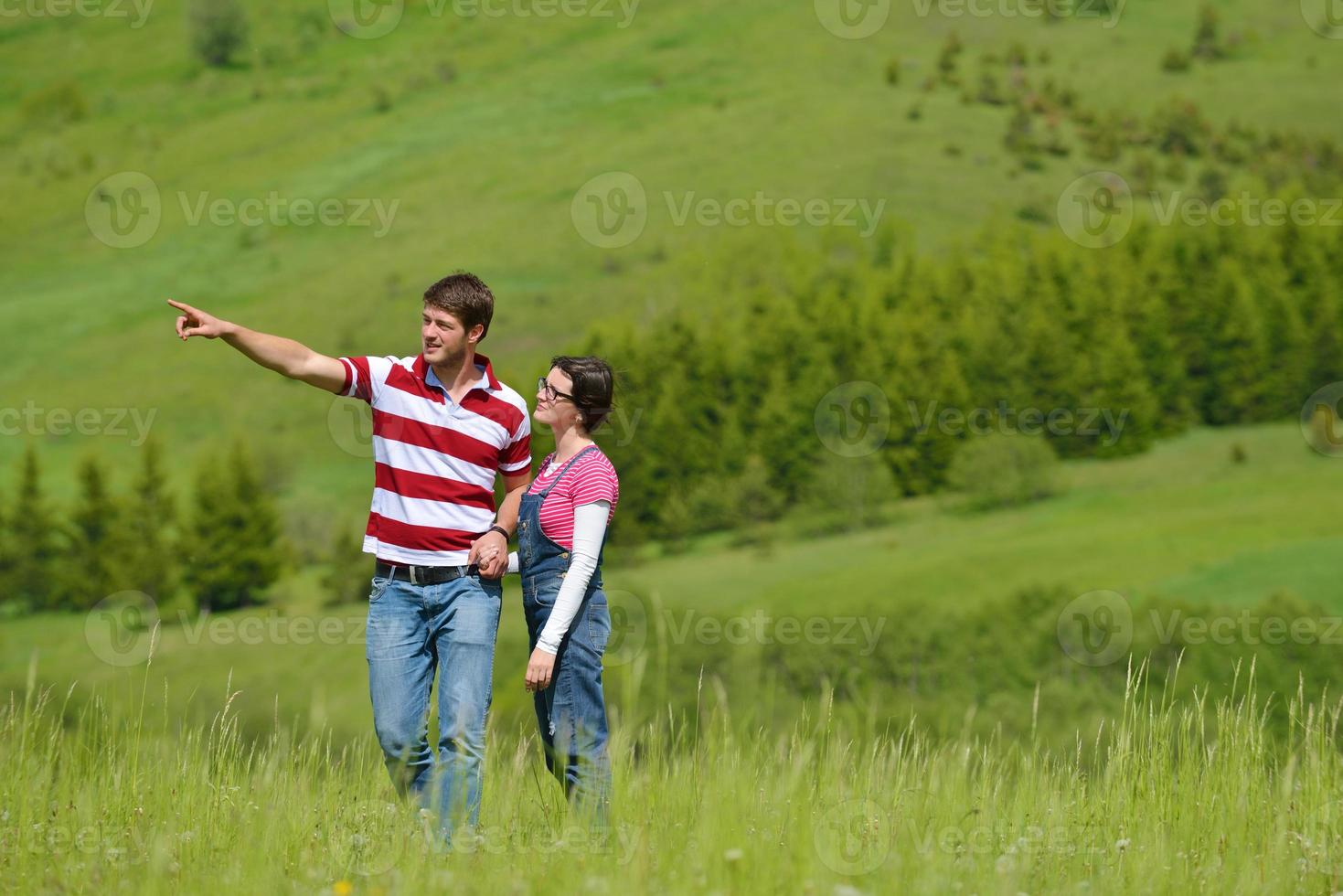 Portrait of romantic young couple smiling together outdoor photo