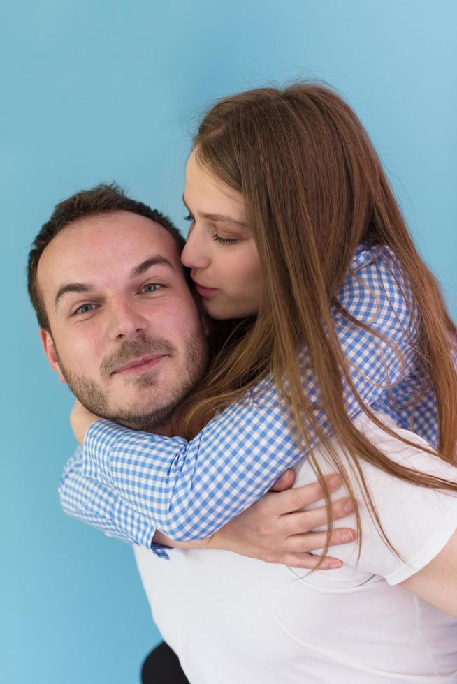 young man piggybacking his girlfriend photo