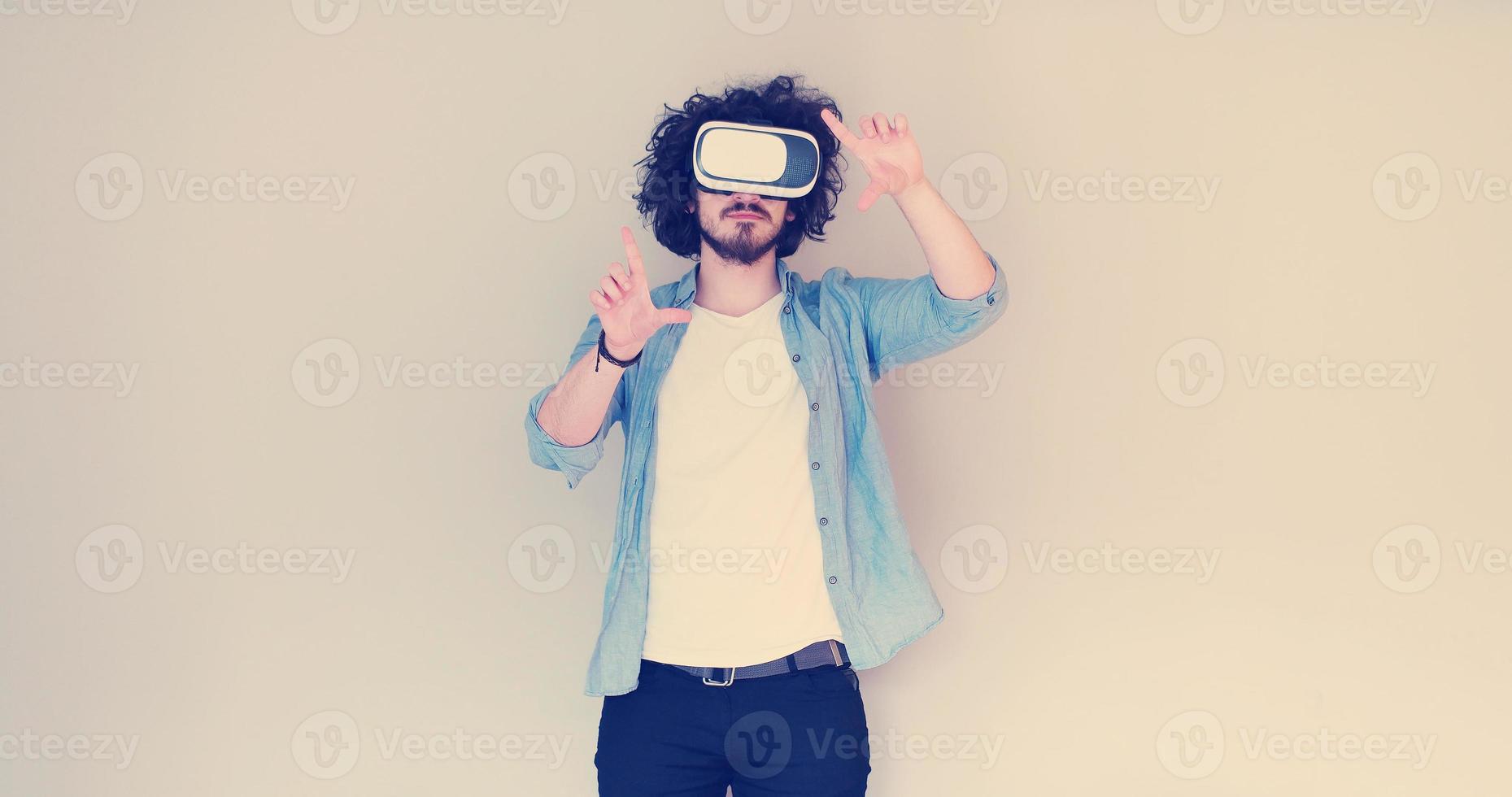 Man using headset of virtual reality photo