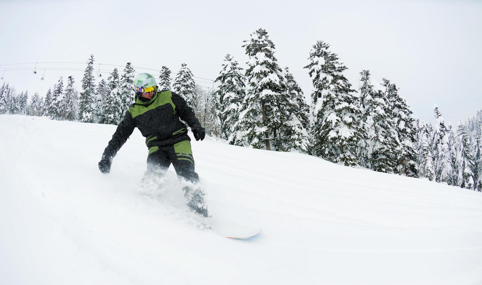snowboarder on fresh deep snow photo