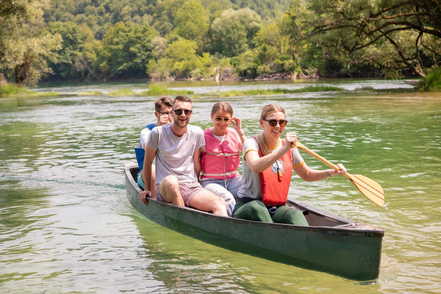 Friends canoeing outside photo