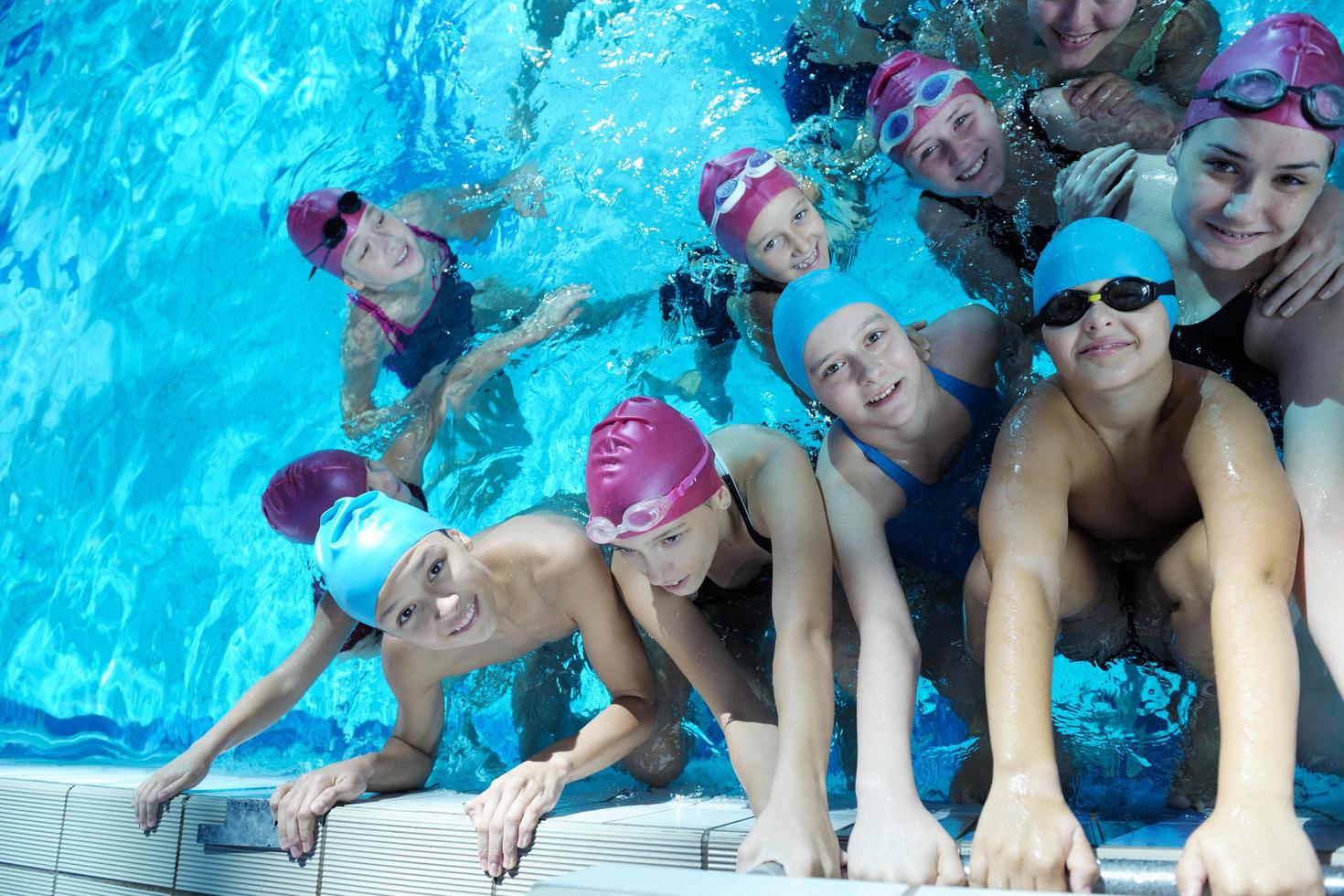 happy children group  at swimming pool photo