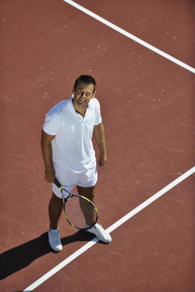 young man play tennis photo