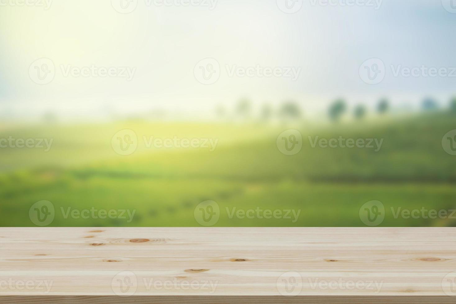 Empty wooden table with view of mountain or wooden desk with plantation nature with bokeh background, copy space for your text photo