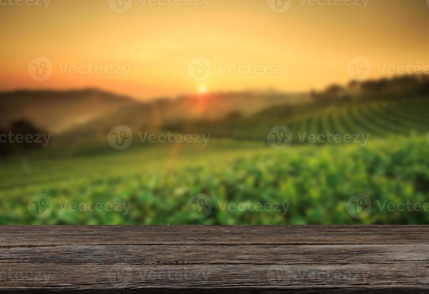 Empty wooden table with view of mountain or wooden desk with plantation nature with bokeh background, copy space for your text photo