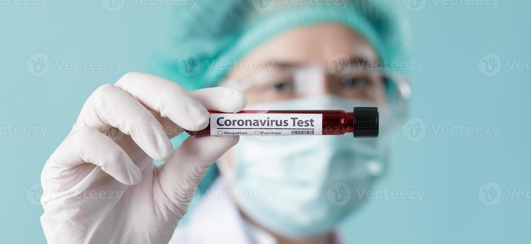 Doctor wearing respirator mask for stop Coronavirus Outbreak COVID-19 and holding testing patients blood samples for Corona Virus from Wuhan China in Laboratory, Empty space isolated on long banner photo