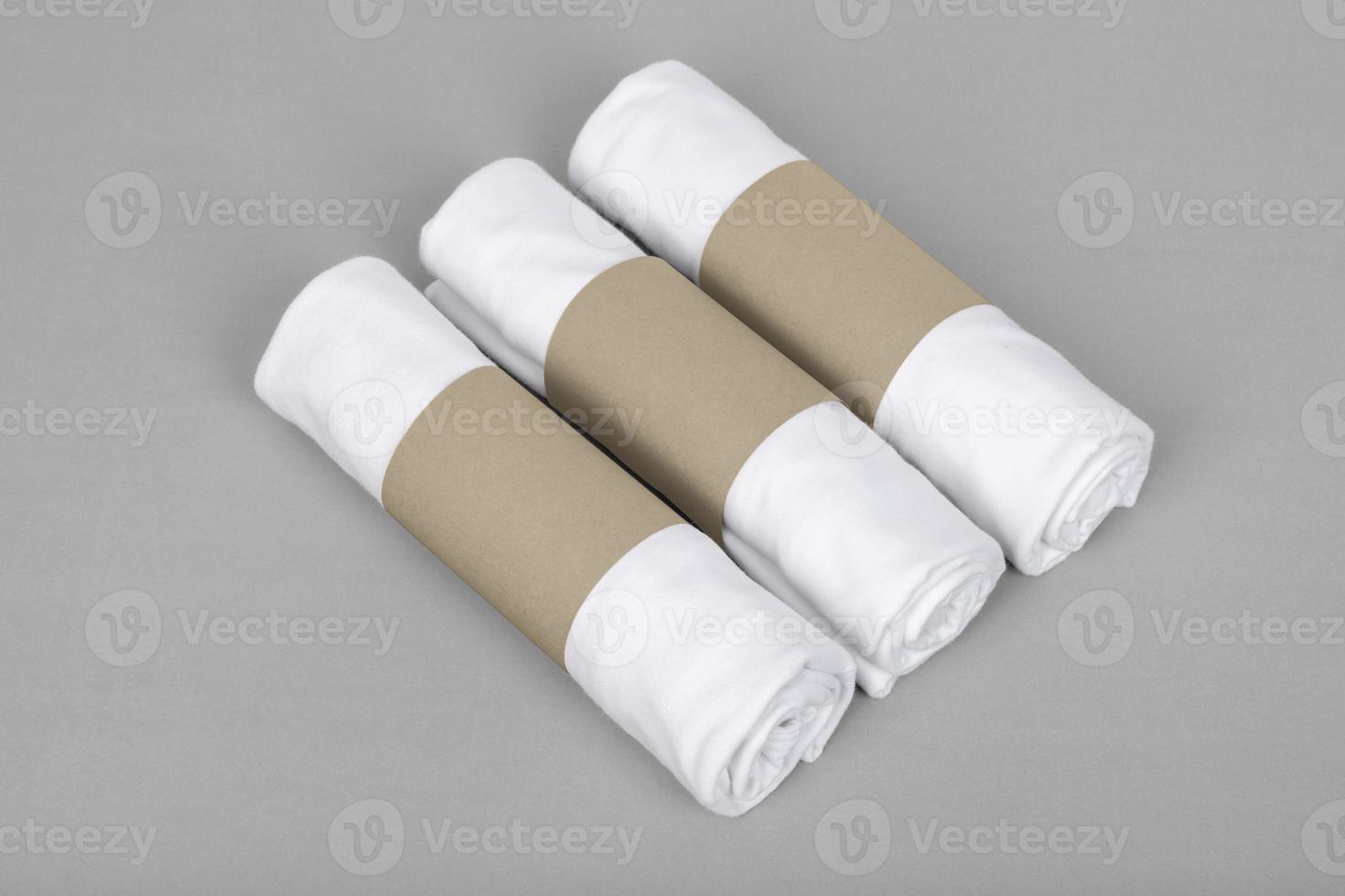 Package with white T-shirt roll mockup template with copy space for your logo or graphic design photo