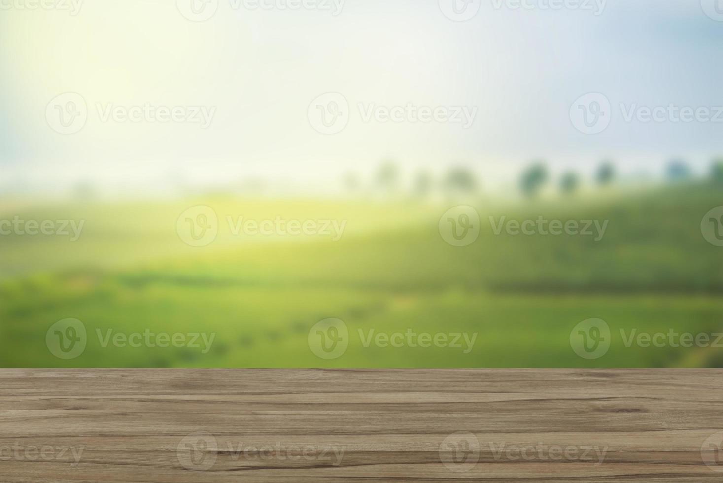 Empty wooden table with view of mountain or wooden desk with plantation nature with bokeh background, copy space for your text photo