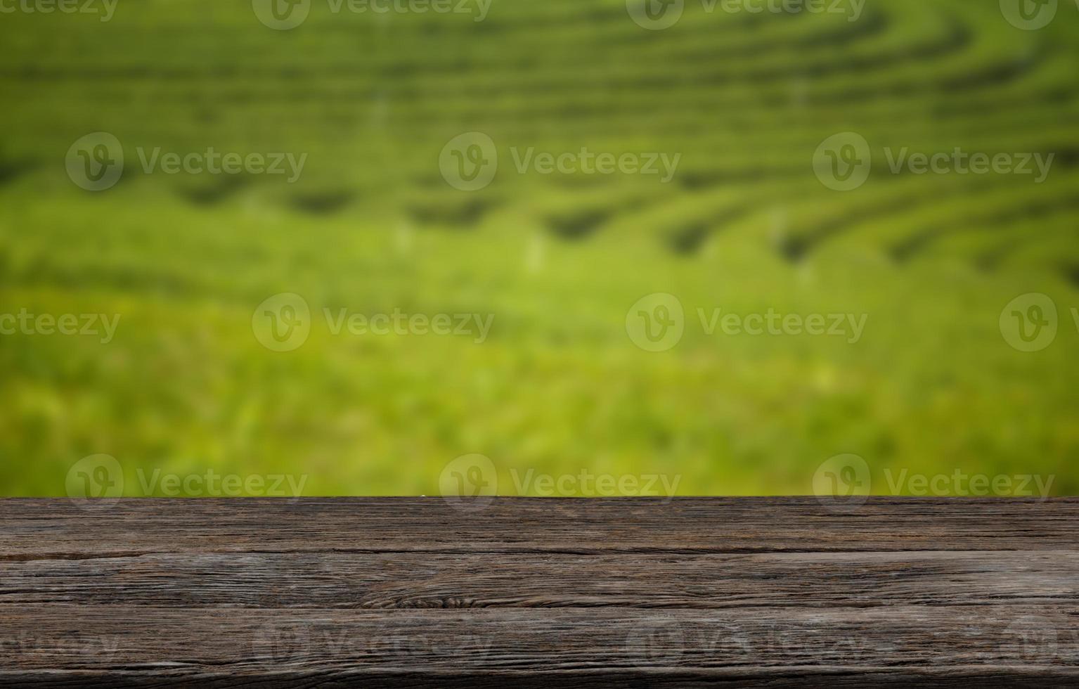 Empty wooden table with view of mountain or wooden desk with plantation nature with bokeh background, copy space for your text photo