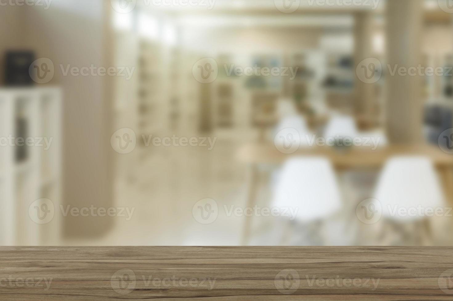 Empty wooden table top with view of office or wooden desk with library room with blur background, copy space for your text photo