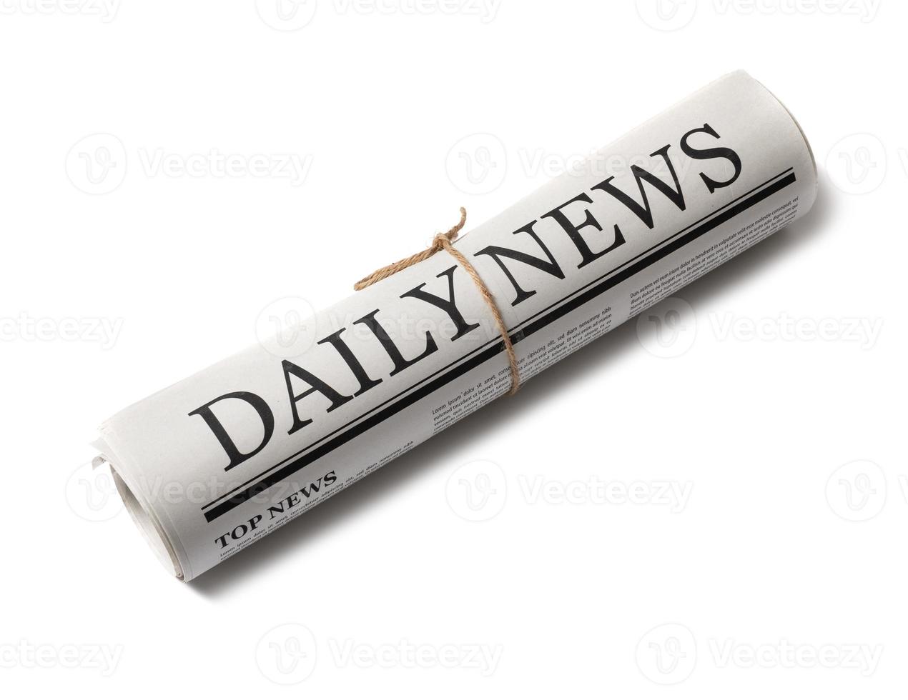 Rolled Business Newspaper with the headline News isolated on white background, Daily Newspaper mock-up concept photo